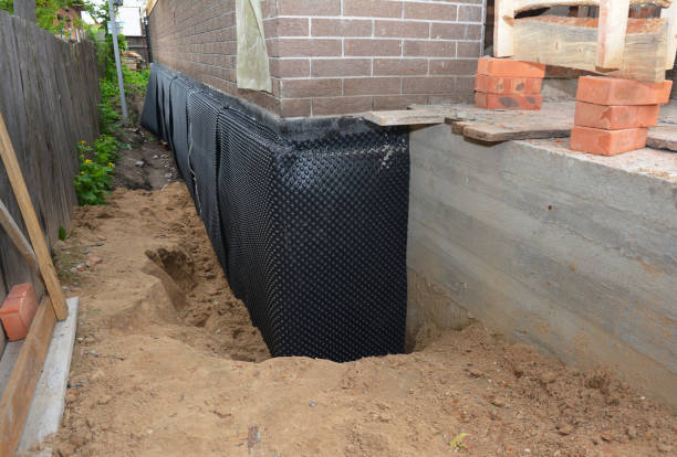 Happy homeowners after waterproofing job in Smithfield
